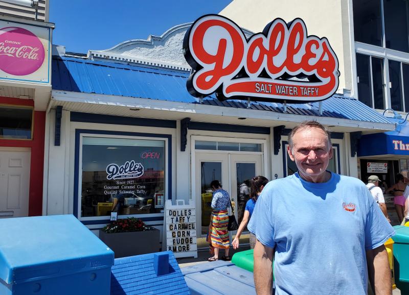 Dolle’s Candyland owner Tom Ibach stands in front of the new Dolle’s location with its new sign. CHRIS FLOOD PHOTO